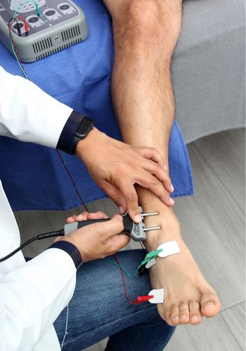 Feet being tested by doctor